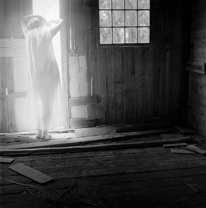 Woman resting in Doorway