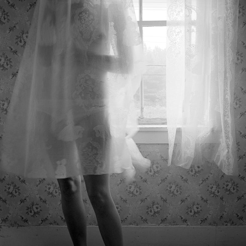 Woman behind Curtain